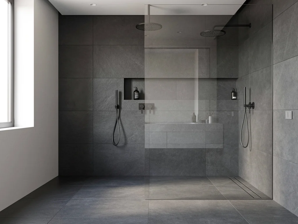 Douche à l'italienne avec paroi vitrée et carrelage grand format anthracite